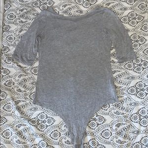 Gray bodysuit.